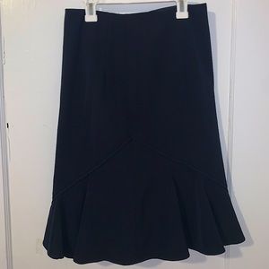 Nanette Lepore black pencil skirt with ‘v’ shape flare at bottom. Size 2.